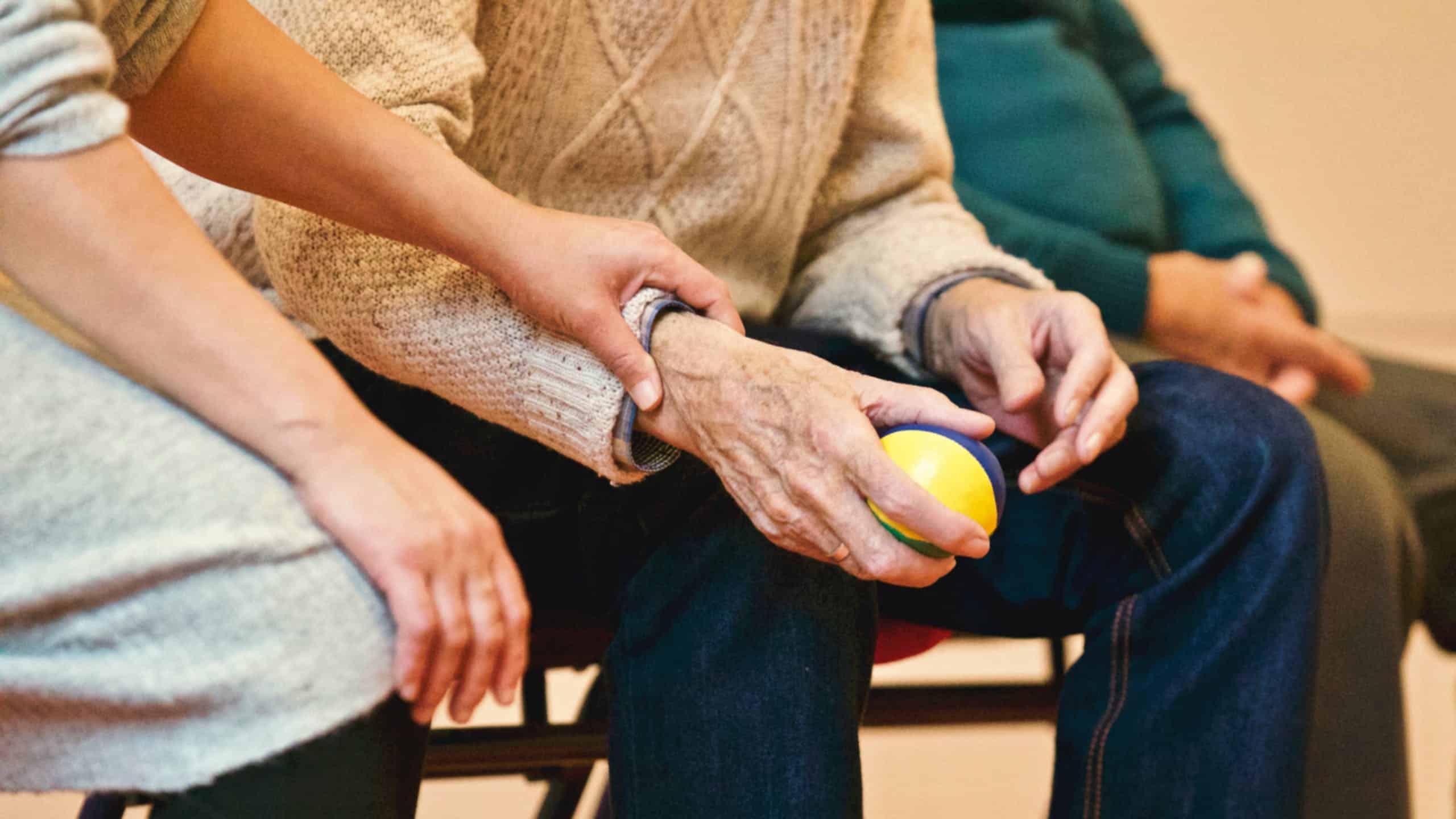 White Oak Perth Carer Holding Hands with Elderly Person